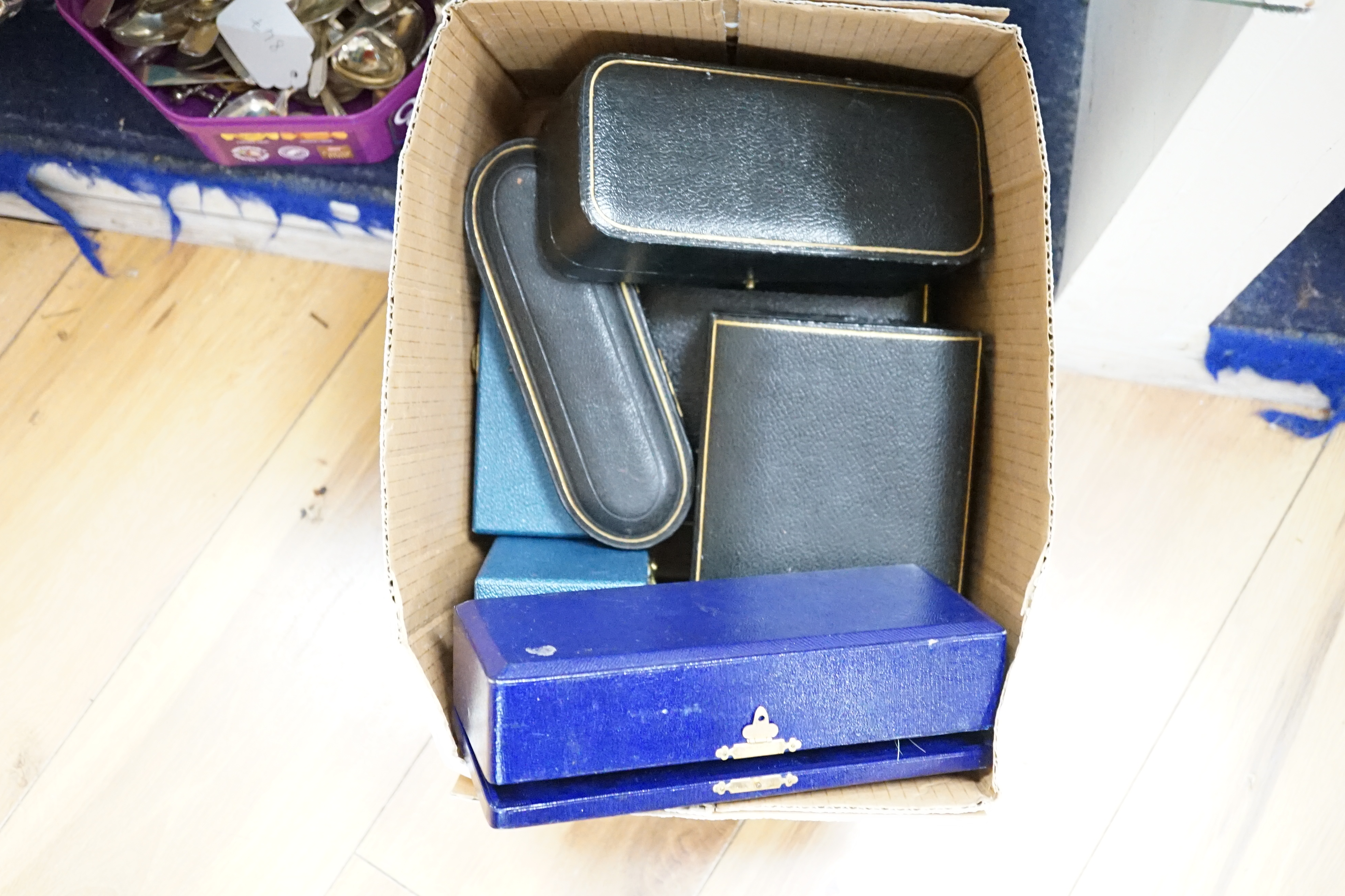 Thirteen assorted cased silver sets, including two sets of six handled tea knives, Leicester and Pudsey replica spoons, two matched sets of napkin rings, single spoon, christening trio, two sets of teaspoons, pair of toa